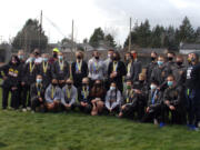 The Prairie boys and girls cross country teams pose for a team photo after both teams swept to team titles at the 3A Greater St. Helens League meet on Thursday, March 25, 2021.