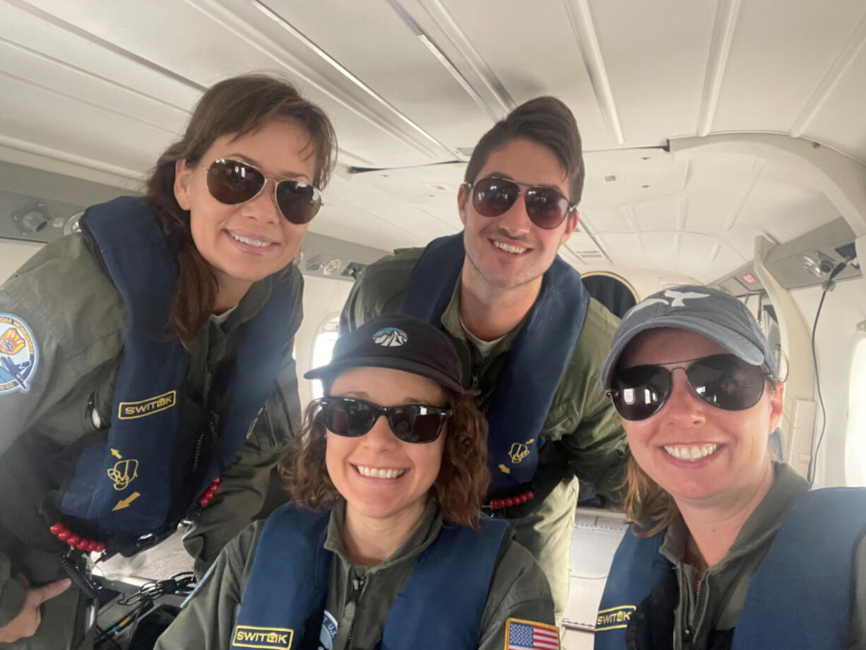 A Clearwater Marine Aquarium Research Institute right whale survey team based in Georgia, from left: Marcy Lee, Ashley Millan Ambert, David Lockwood and Melanie White.