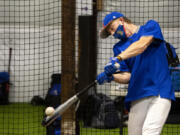 Ridgefield senior Aidan Hundt swings during batting practice. Hundt sustained a broken leg his sophomore year playing football, but is back on the diamond and ready to lead the Spudders.