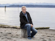 Rick Steves sits on the beach in downtown Edmonds in April 2020.