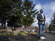Pastor Damion Young, who contracted COVID-19 and still struggles with symptoms, poses for a portrait at his Vancouver apartment complex. Young worked as an Amazon truck driver, but has struggled to return to work because of long-term symptoms from COVID-19.
