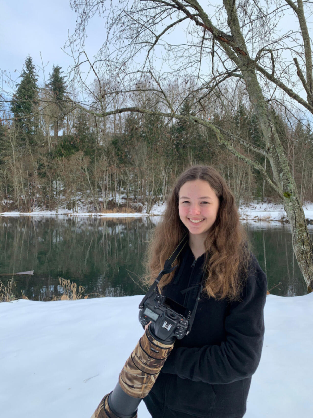 Katie Warner, 13, shown here with her camera near Salmon Creek, was recently named the American Birding Association's 2021 Young Birder of the Year.