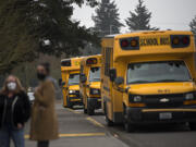 Buses arrive to drop off freshmen for an orientation day at Evergreen High School on Tuesday morning, March 2, 2021.