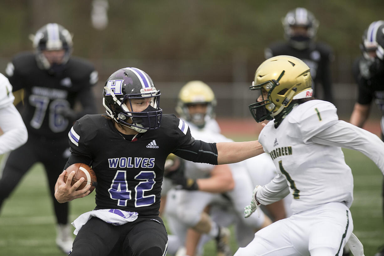 Heritage's Andre Cowley (42) takes on Evergreen’s Tejuan Conde (1) in the second quarter at McKenzie Stadium on Friday afternoon, March 5, 2021.