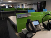 Deserted desks line the main office of ZoomInfo in downtown Vancouver.(Amanda Cowan/The Columbian)