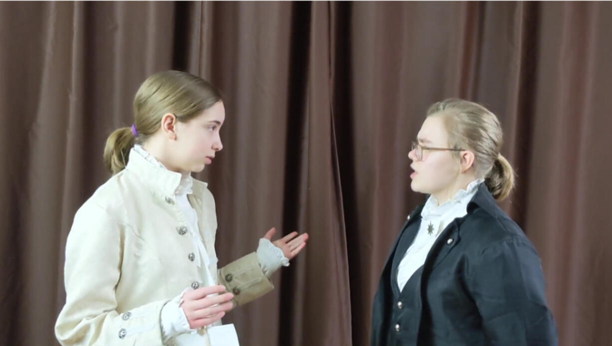 BATTLE GROUND: Pleasant Valley Middle School 8th graders Kira Wilson, left, and Amelia DeMoss, right, placed first in the Junior Group Performance category for National History Day.