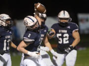 Skyview’s Rhett Sarvala spikes the ball after a one-handed 30-yard touchdown catch in a 4A/3A Greater St. Helens League game on Thursday, March 18, 2021, at Kiggins Bowl. Skyview won 49-7.