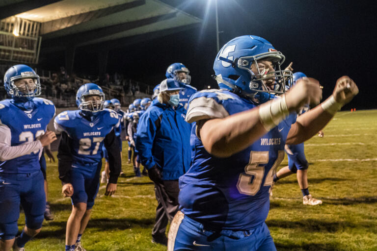 The La Center sideline reacts to their win over Castle Rock during a game at La Center High School on Friday night, March 19, 2021 (Nathan Howard for The Columbian)