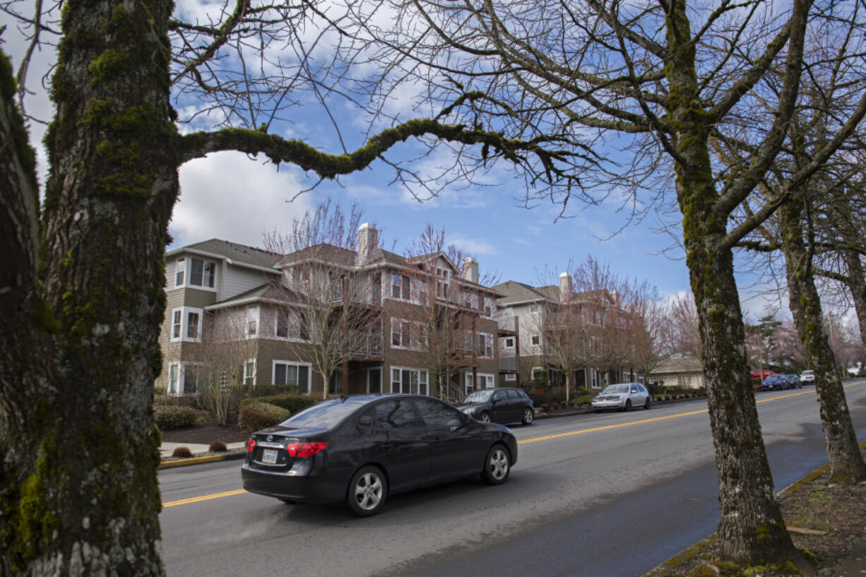 A motorist drives past Camas Ridge Apartments on Monday morning.