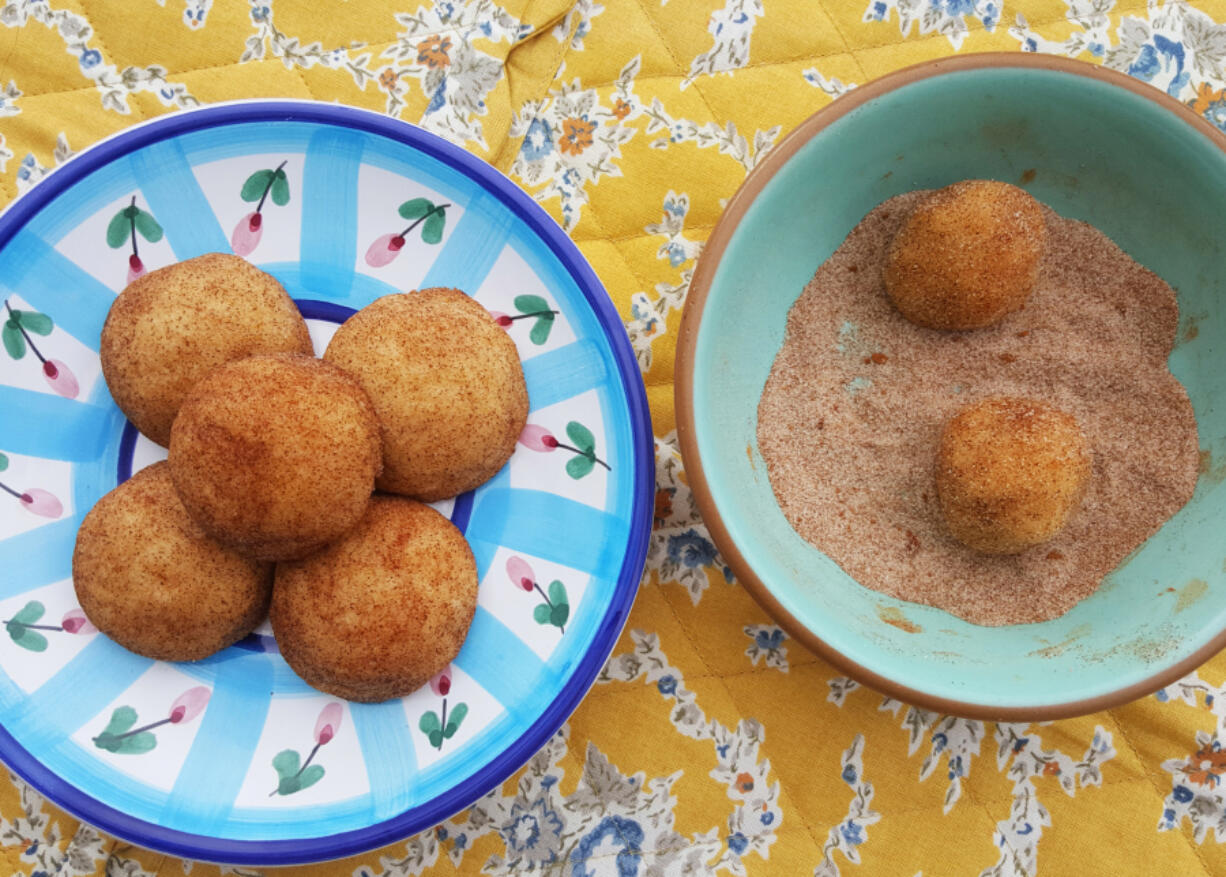 Go ahead, play with your food! Get your fingers in the dough and roll the snickerdoodles in a generous coating of sugar and cinnamon.