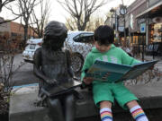 WASHOUGAL: Luca Batemen, 4, enjoys a book from the General Federation of Women&#039;s Clubs Camas-Washougal.