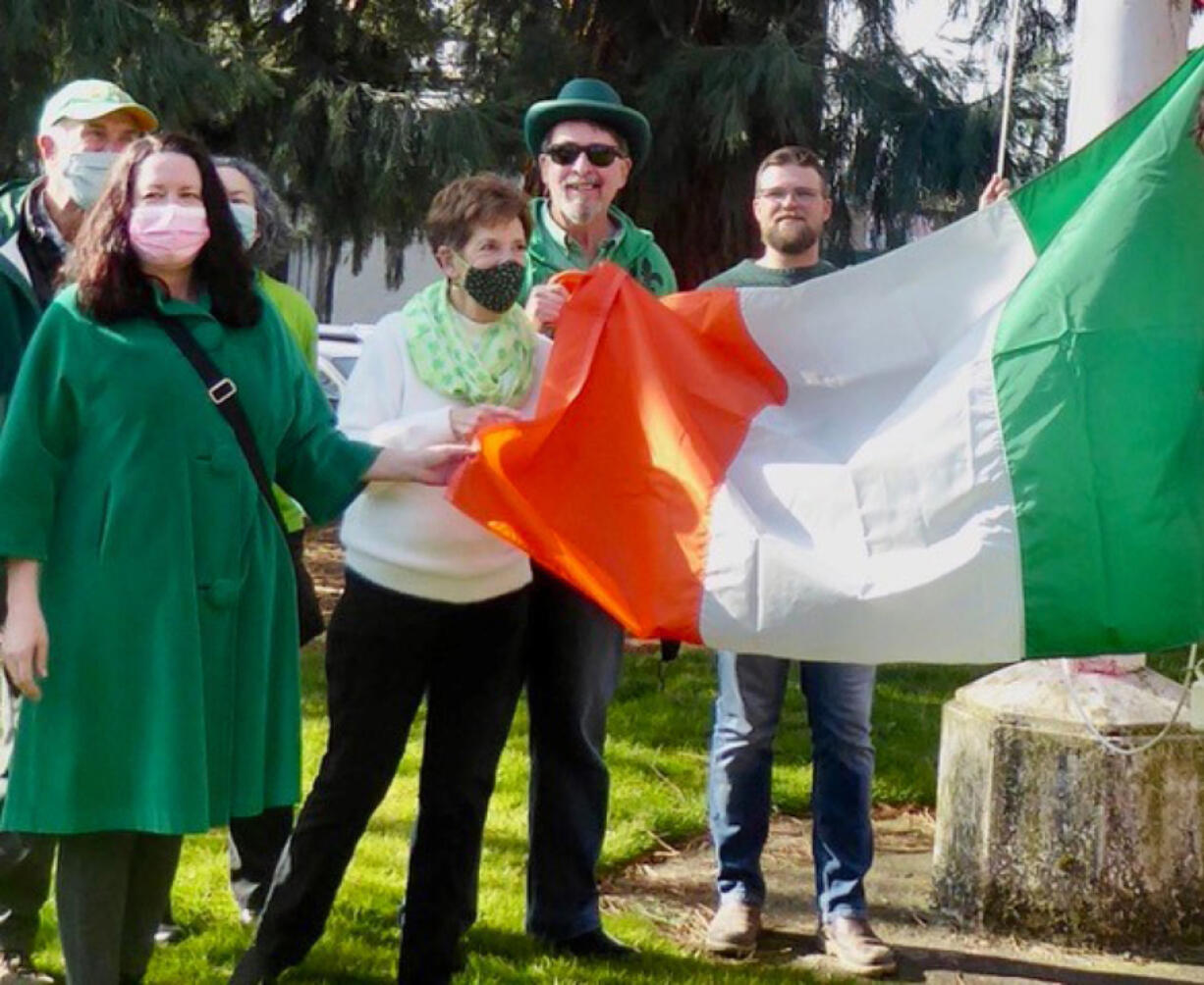 ESTHER SHORT: Family and friends of Denny Lane, the city&#039;s first constable, raised an Irish flag in front of the Clark County courthouse on St.