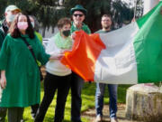 ESTHER SHORT: Family and friends of Denny Lane, the city&#039;s first constable, raised an Irish flag in front of the Clark County courthouse on St.