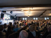 A crowd of more than 200 people listens to opening remarks from candidates running to represent Washington&#039;s 3rd Congressional District on Tuesday during a forum at Church on the Rock in Battle Ground.