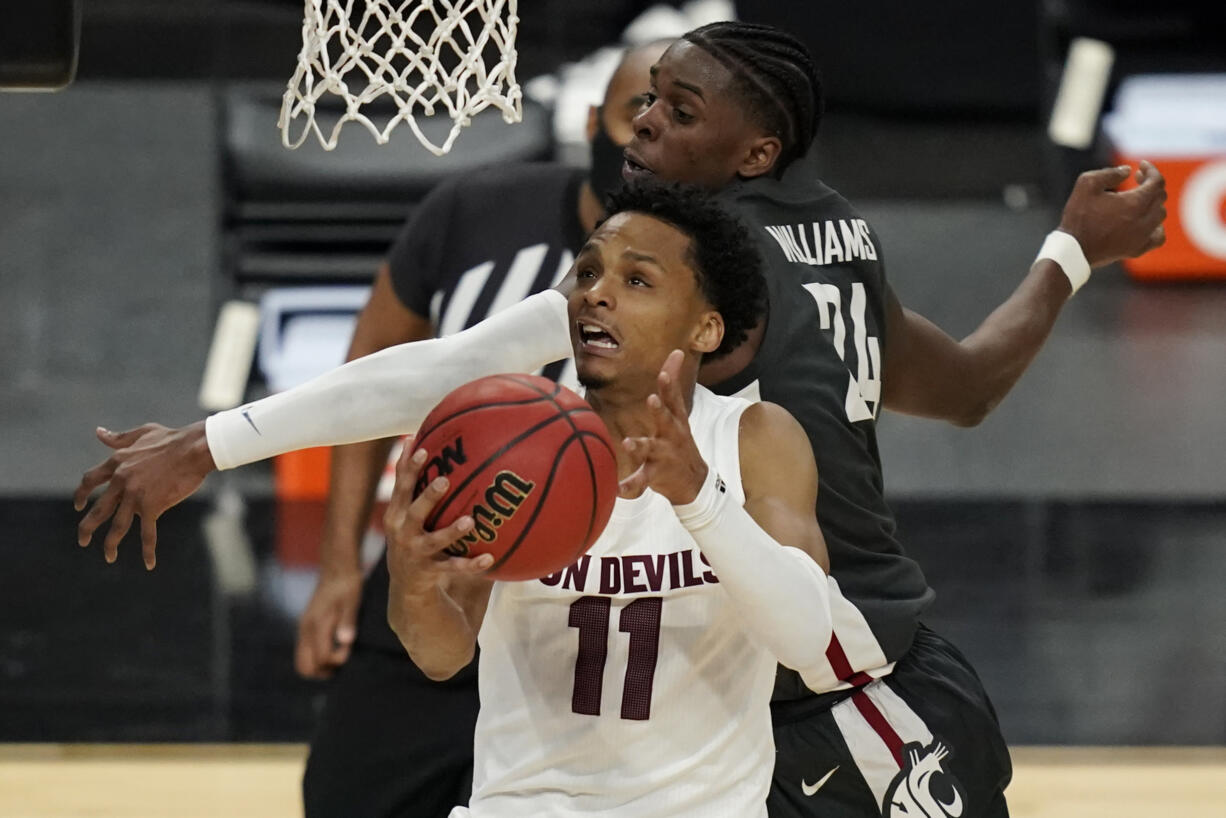 Arizona State's Alonzo Verge Jr. (11) shoots around Washington State's Noah Williams (24) during the second half of an NCAA college basketball game in the first round of the Pac-12 men's tournament Wednesday, March 10, 2021, in Las Vegas.