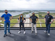 In this photo provided by SpaceX, Jared Isaacman, from left to right, Hayley Arceneaux, Sian Proctor and Chris Sembroski pose for a photo, Monday, March 29, 2021, from the SpaceX launch tower at NASA’s Kennedy Space Center at Cape Canaveral, Fla.