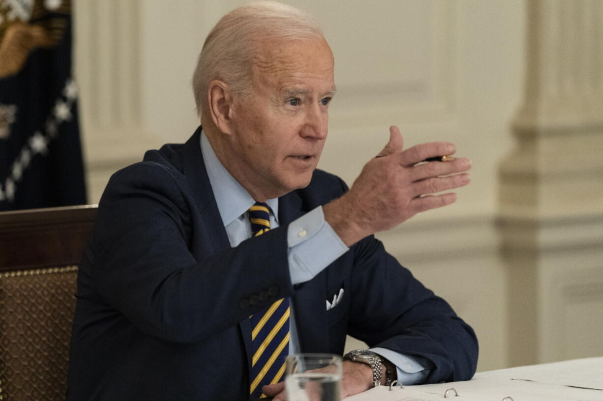 President Joe Biden speaks during a virtual meeting with Indian Prime Minister Narendra Modi, Australian Prime Minister Scott Morrison and Japanese Prime Minister Yoshihide Suga, from the State Dining Room of the White House, Friday, March 12, 2021, in Washington.