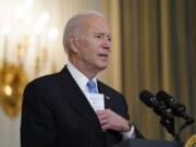 President Joe Biden speaks about efforts to combat COVID-19, in the State Dining Room of the White House, Tuesday, March 2, 2021, in Washington.