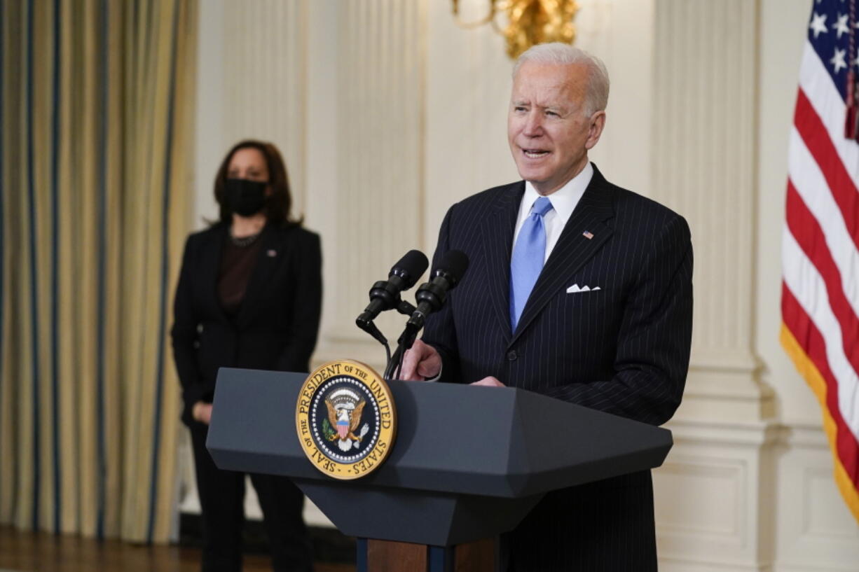 President Joe Biden, accompanied by Vice President Kamala Harris, speaks about efforts to combat COVID-19, in the State Dining Room of the White House, Tuesday, March 2, 2021, in Washington.