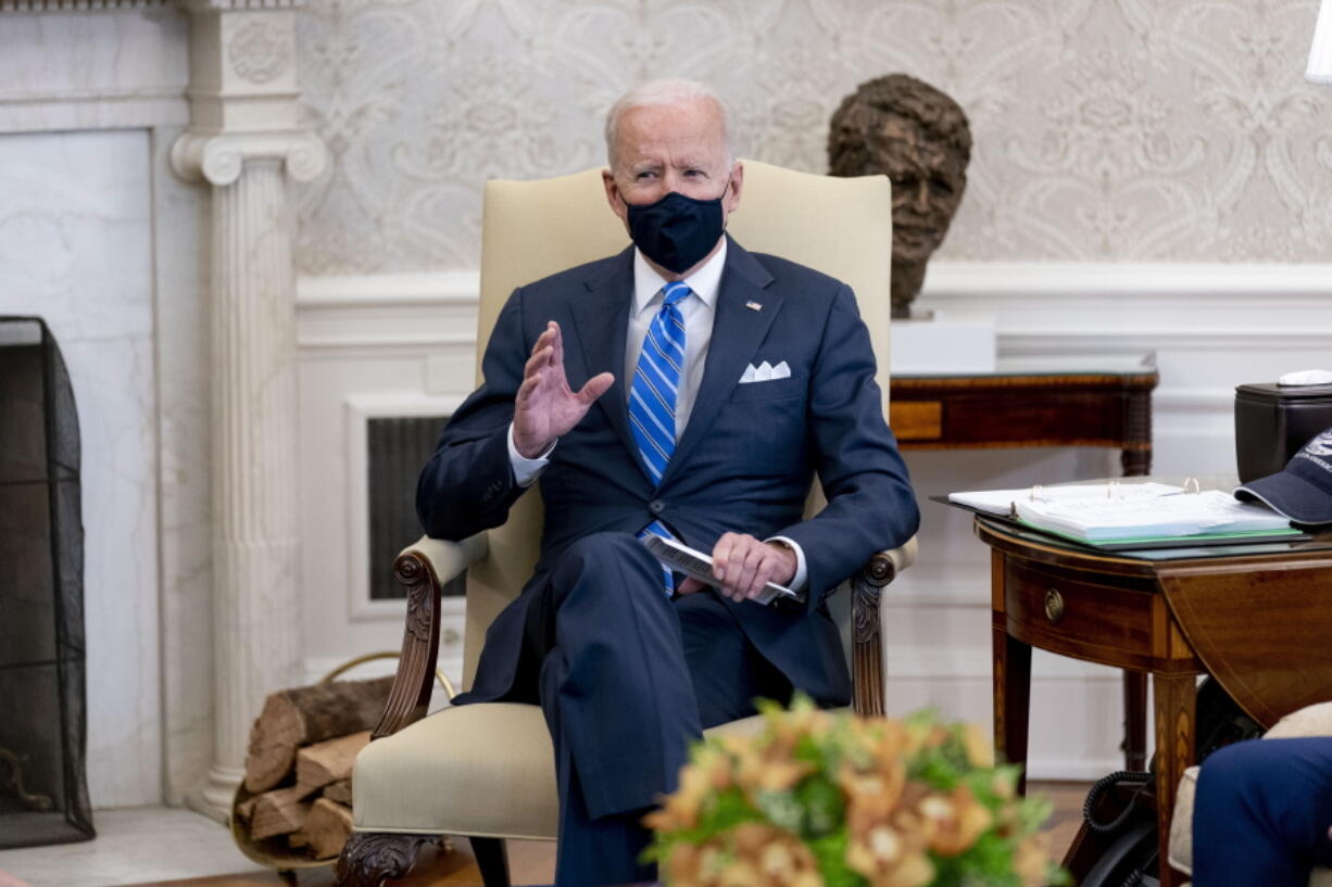 President Joe Biden, speaks as he meets with Vice President Kamala Harris, Transportation Secretary Pete Buttigieg, and members of the House of Representatives in the Oval Office of the White House in Washington, Thursday, March 4, 2021, on infrastructure.