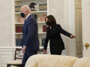 President Joe Biden and Vice President Kamala Harris, arrive at the Oval Office of the White House, Thursday, March 11, 2021, in Washington.