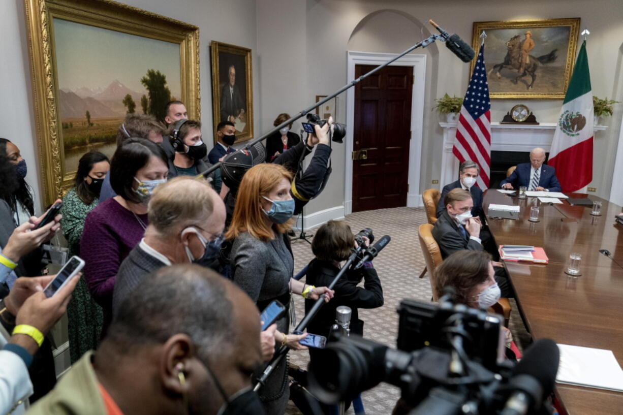 President Joe Biden, right, attends a virtual meeting with Mexican President Andres Manuel Lopez Obrador in the Roosevelt Room of the White House, Monday, March 1, 2021, in Washington. Also pictured is Secretary of State Antony Blinken, second from right, and White House national security adviser Jake Sullivan, third from right.