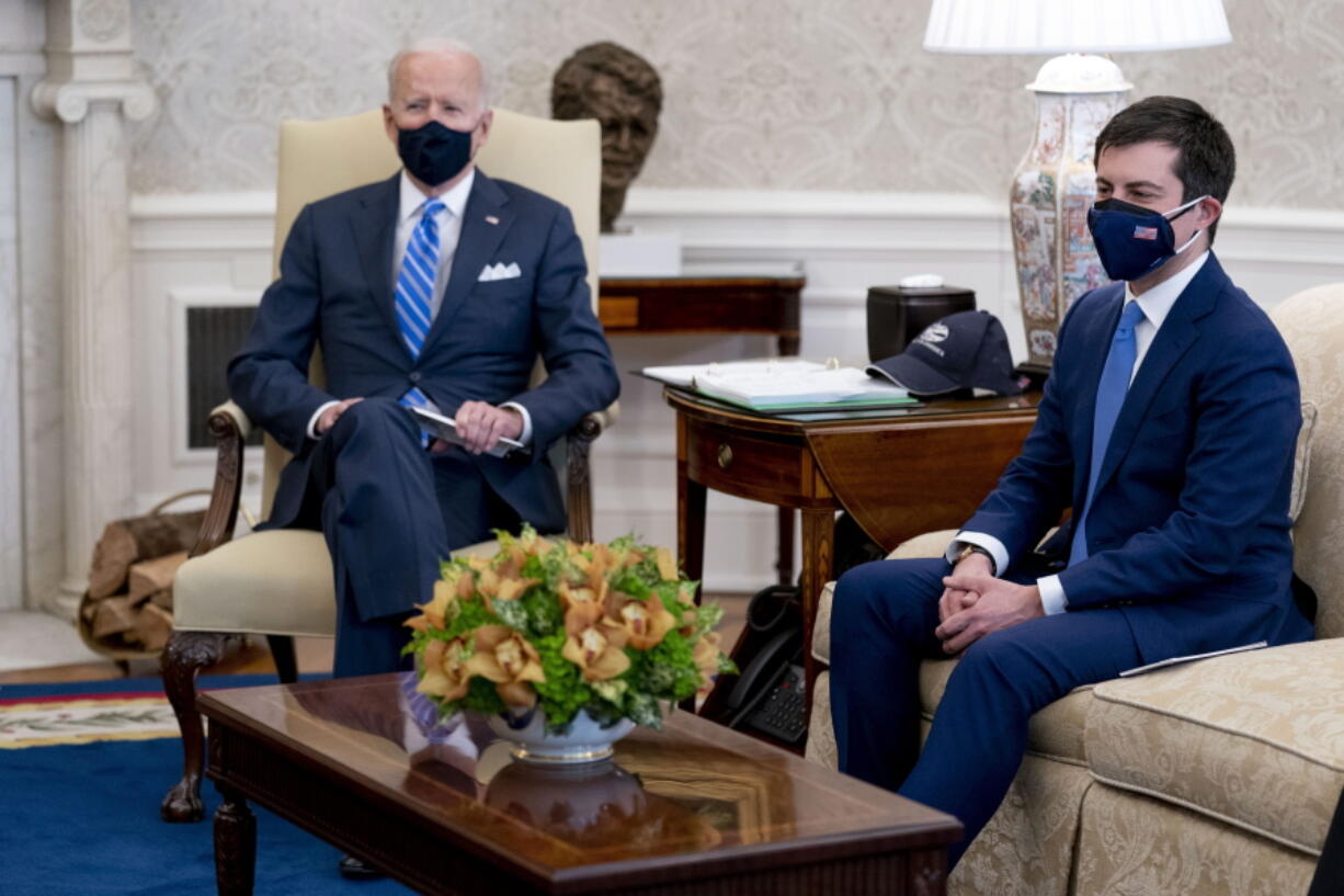 FILE - In this March 4, 2021, file photo, President Joe Biden and Transportation Secretary Pete Buttigieg, right, meet with Vice President Kamala Harris and members of the House of Representatives in the Oval Office of the White House in Washington, on infrastructure. Buttigieg says America&#039;s infrastructure needs exceed $1 trillion and that other countries like China are pulling ahead. It&#039;s a disparity that Buttigieg is calling &quot;a threat to our collective future&quot; in prepared remarks to Congress.