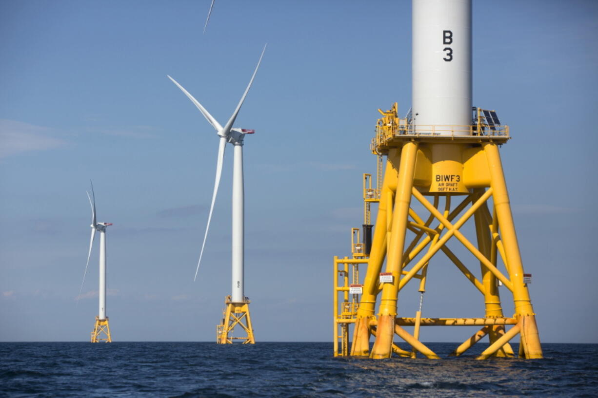 FILE - In this Monday, Aug. 15, 2016, file photo, three of Deepwater Wind&#039;s turbines stand in the water off Block Island, R.I.