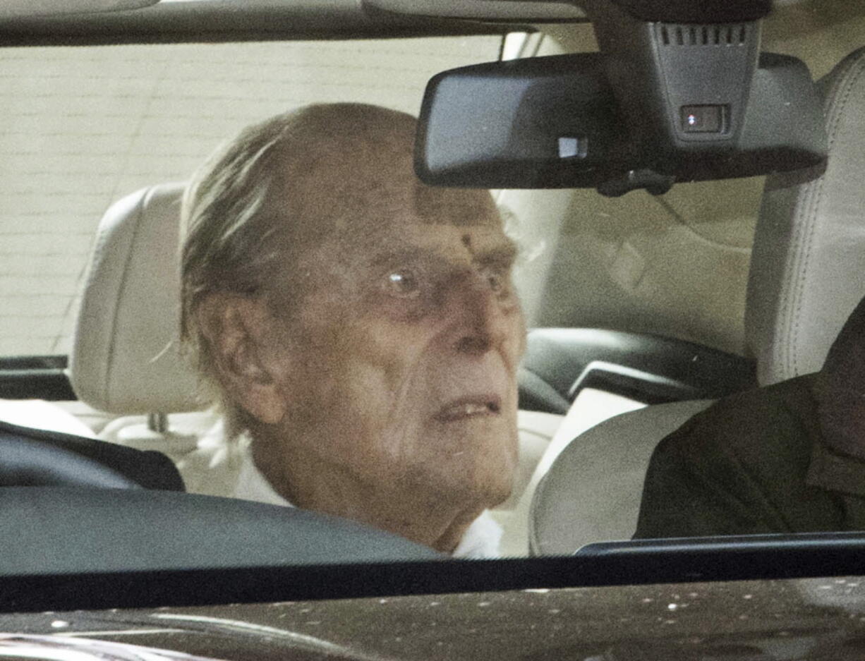 Britain&#039;s Prince Philip as he leaves the King Edward VII hospital in the back of a car in London, Tuesday, March 16, 2021. The 99-year-old husband of Queen Elizabeth II has been hospitalized after a heart procedure.