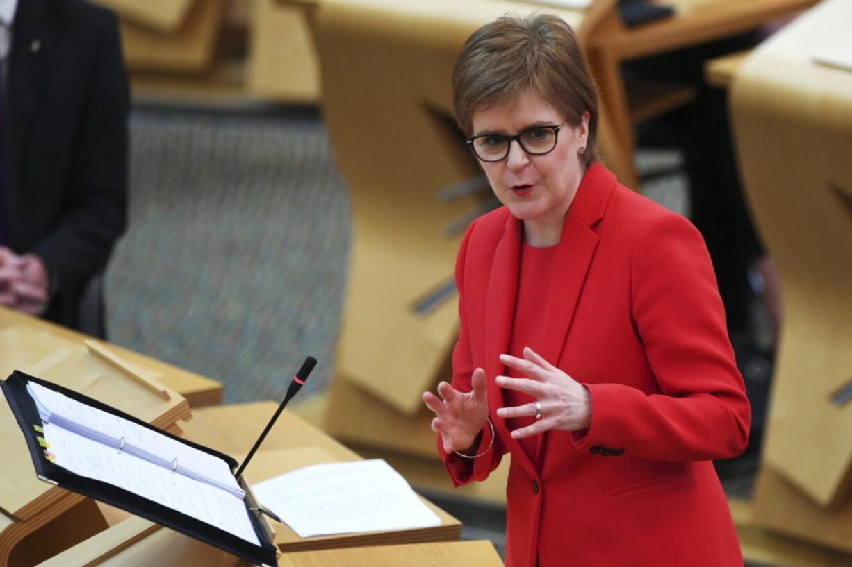 Scotland&#039;s First Minister Nicola Sturgeon speaks at the Holyrood Scottish Parliament in Edinburgh, Scotland, Thursday March 18, 2021.  Scottish leader Nicola Sturgeon has dismissed suggestions that she misled lawmakers, saying she stands by testimony she gave to the Scottish parliament committee investigating her government&#039;s handling of sexual harassment allegations against her predecessor Alex Salmond.