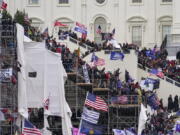 FILE - In this Jan. 6, 2021 file photo insurrectionists loyal to President Donald Trump riot outside the Capitol in Washington.