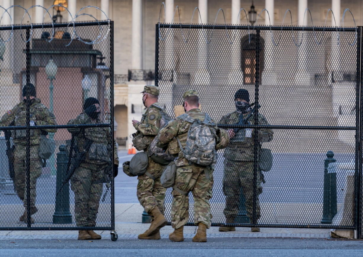 National Guard troops keep watch at the Capitol in Washington, early Thursday, March 4, 2021, amid intelligence warnings that there is a &quot;possible plot&quot; by a group of militia extremists to take control of the Capitol on March 4 to remove Democrats from power. The threat comes nearly two months after thousands of supporters of then-President Donald Trump stormed the Capitol in a violent insurrection as Congress was voting to certify Joe Biden&#039;s electoral win. (AP Photo/J. Scott Applewhite) (j.