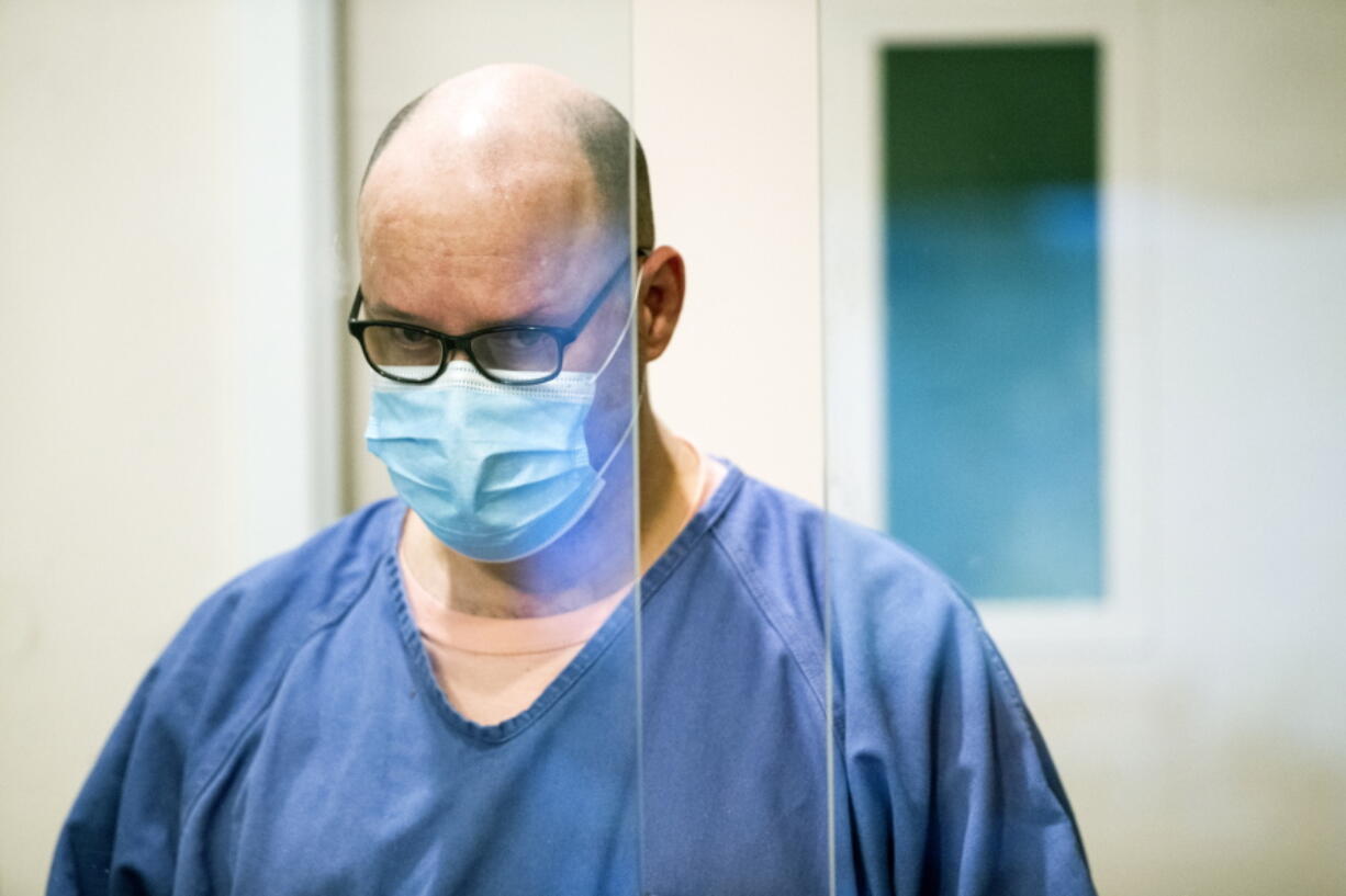 Christopher Lovrien, 53, is arraigned in Multnomah County Circuit Court on Thursday, March 11, 2021. The Portland, Oregon, man accused of killing two strangers who disappeared 20 years apart pleaded not guilty to murder charges after authorities investigating the earlier case said they found dismembered human remains of another man in the suspect&#039;s shed.