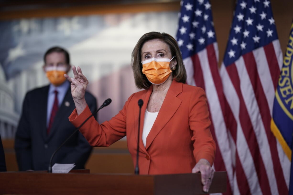 Speaker of the House Nancy Pelosi, D-Calif., holds a news conference on passage of gun violence prevention legislation, at the Capitol in Washington, Thursday, March 11, 2021, as Sen. Richard Blumenthal, D-Conn., looks on. (AP Photo/J.