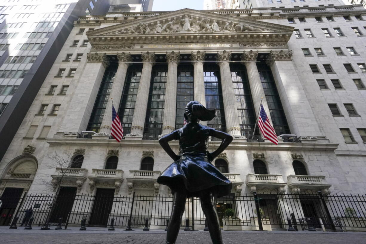 The Fearless Girl statue stands in front of the New York Stock Exchange in New York&#039;s Financial District, Tuesday, March 23, 2021.  Stocks are off to a solid start on Wall Street as banks made up some of the ground they lost a day earlier. Industrial companies were also strong early Wednesday, March 24 helping to push the benchmark S&amp;P 500 index up 0.5% in the first few minutes of trading.