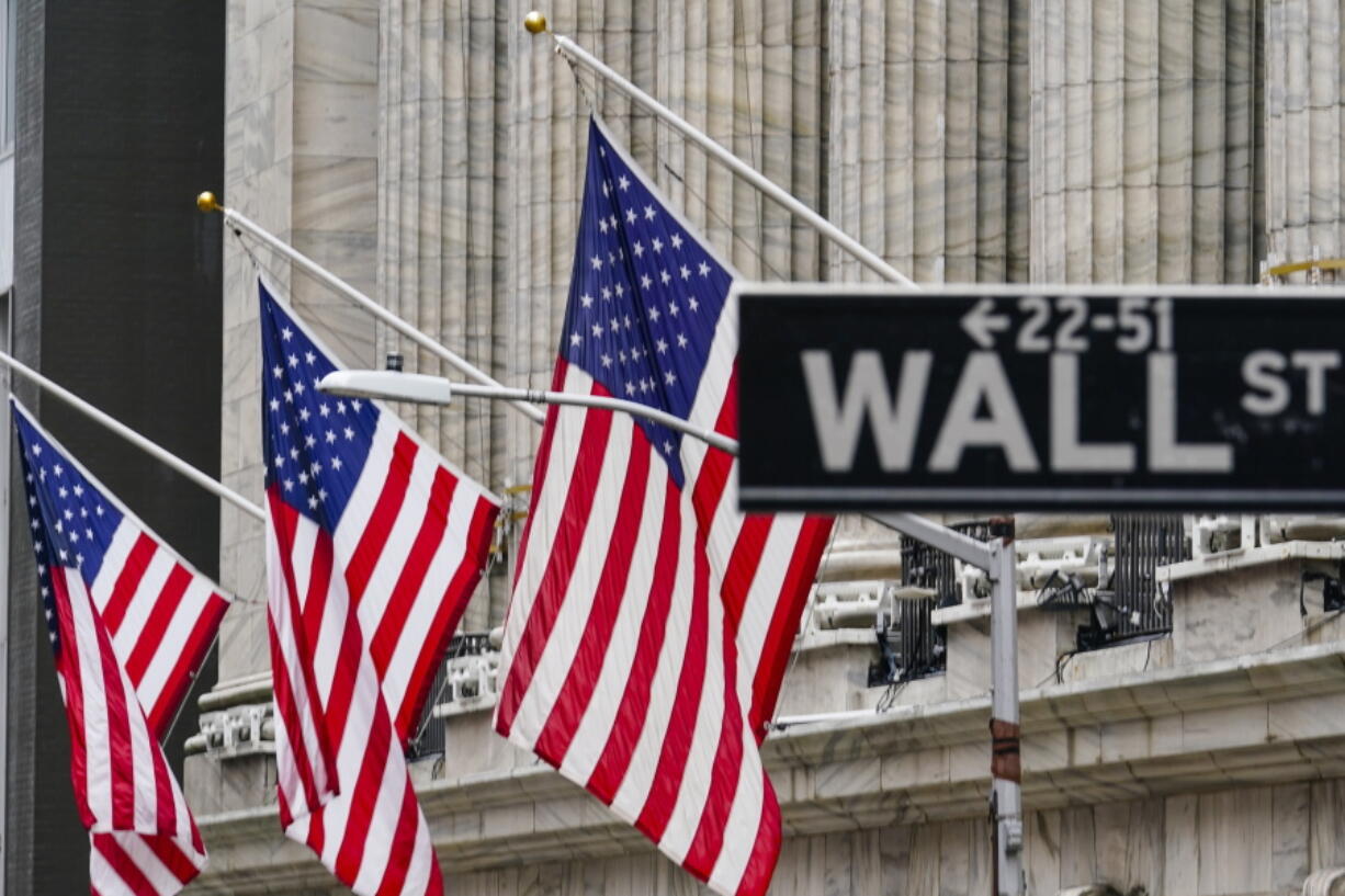 FILE - American flags hang outside of the New York Stock Exchange, in this Tuesday, Feb. 16, 2021, file photo.  Stocks are starting higher on Wall Street with an assist from technology companies, which have seen big swings in recent days. The S&amp;P 500 index was up 0.7% in the early going Thursday, March 11, while the tech-heavy Nasdaq was up 1.7%.