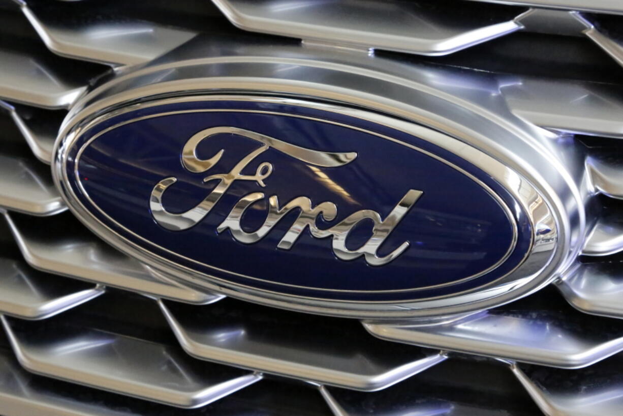 FILE- This Feb. 15, 2018, file photo shows a Ford logo on the grill of a 2018 Ford Explorer on display at the Pittsburgh Auto Show. Edsel B. Ford II is retiring from the board of Ford Motor after serving as a board member for 33 years. The automaker also named some other members of the famous family as board nominees. Board nominees will be up for election at Ford&#039;s annual meeting on May 13, 2021. (AP Photo/Gene J.