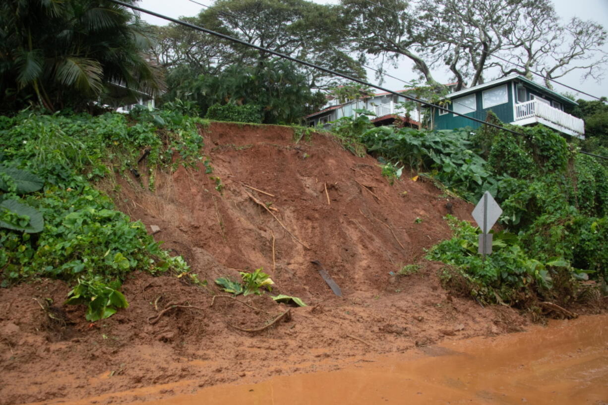 A mudslide leaves Kamehameha Highway coated near Pokole Point on Tuesday, March 9, 2021, near Kahaluu, Hawaii. The entire state was under a flash flood watch amid heavy rains expected to last through Wednesday morning. (Craig T.