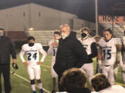 Coach Rick Steele addresses his team after its 24-14 victory Friday over Washougal.