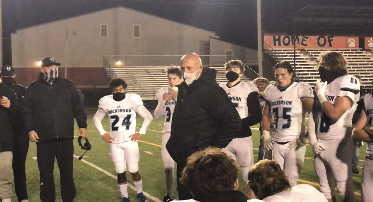 Coach Rick Steele addresses his team after its 24-14 victory Friday over Washougal.
