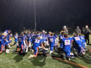 Ridgefield football coach Scott Rice talks to his team after a 49-0 win over Mark Morris on Friday at Ridgefield High School.