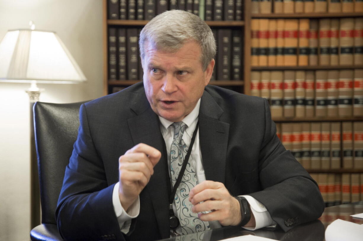 FILE - This March 1, 2017 file photo shows Idaho Attorney General Lawrence Wasden during an interview in Boise, Idaho. GOP Idaho lawmakers frustrated with the Republican Idaho attorney general have put forward a series of bills that could significantly defund his office. Wasden irked lawmakers by not joining a Texas lawsuit to invalidate the presidential election.