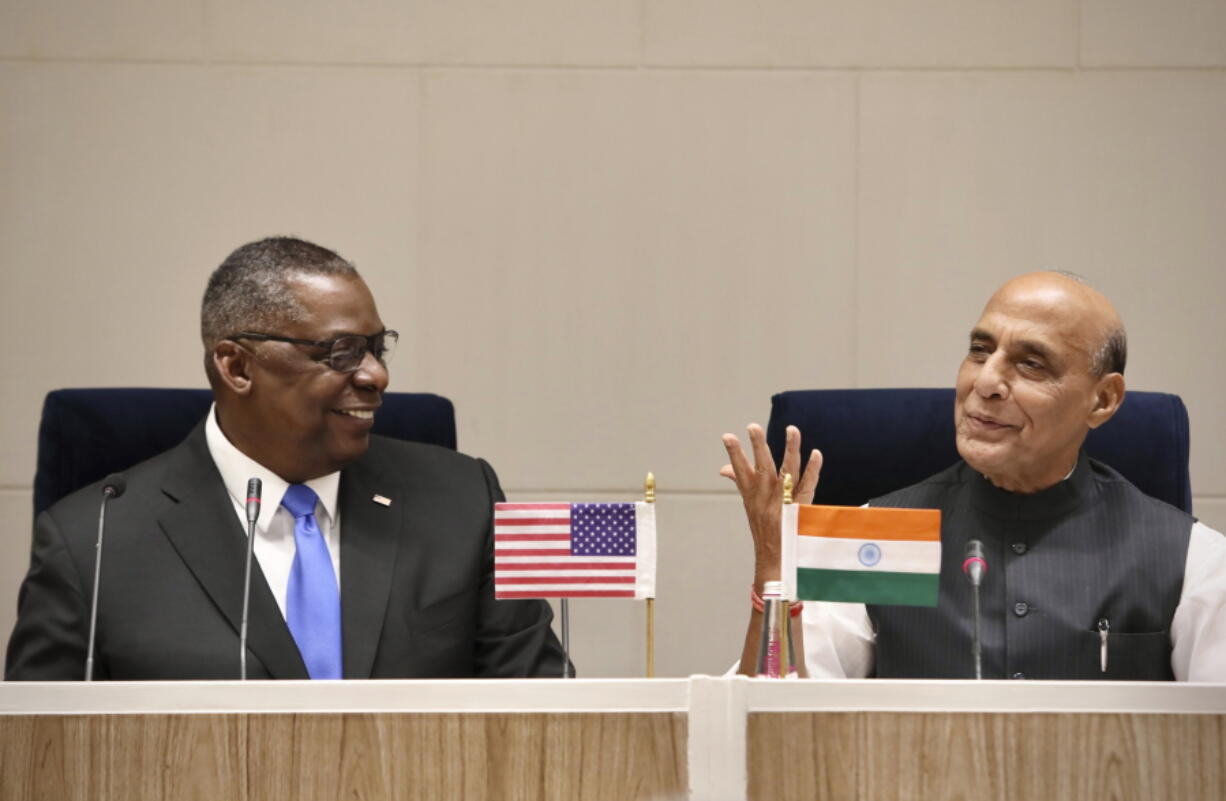 Indian Defense Minister Rajnath Singh and U.S. Defense Secretary Lloyd Austin sit to deliver a joint press statement in New Delhi, India, Saturday, March 20, 2021. The top officials from India and the United States Saturday said the two countries will expand their military engagement, underscoring a sign of strengthening defense ties between the two democracies amid China&#039;s growing influence in the Indo-Pacific region.