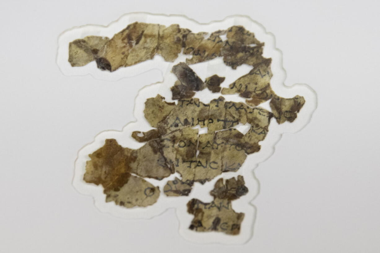 The Israel Antiquities Authority displays newly discovered Dead Sea Scroll fragments at the Dead Sea scrolls conservation lab in Jerusalem, Tuesday, March 16, 2021. Israeli archaeologists on Tuesday announced the discovery of dozens of new Dead Sea Scroll fragments bearing a biblical text found in a desert cave and believed hidden during a Jewish revolt against Rome nearly 1,900 years ago.