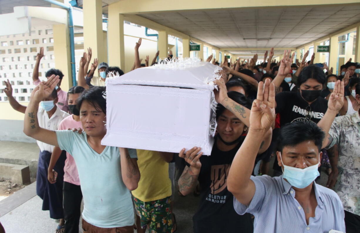 People carry the coffin of a man who was killed during a clash with Myanmar&#039;s security forces, during his cremation in Yangon, Myanmar, Monday, March 29, 2021. Over 100 people across the country were killed by security forces on Saturday alone, including several children - a toll that has prompted a U.N. human rights expert to accuse the junta of committing &quot;mass murder&quot; and to criticize the international community for not doing enough to stop it.