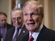 FILE - In this Nov. 13, 2018 file photo, Sen. Bill Nelson, D-Fla., attends a news conference at the Capitol in Washington.  President Joe Biden has chosen Nelson, a former senator from Florida who flew on the space shuttle to lead NASA. Biden announced his intent Friday, March 19, 2021.(AP Photo/J.