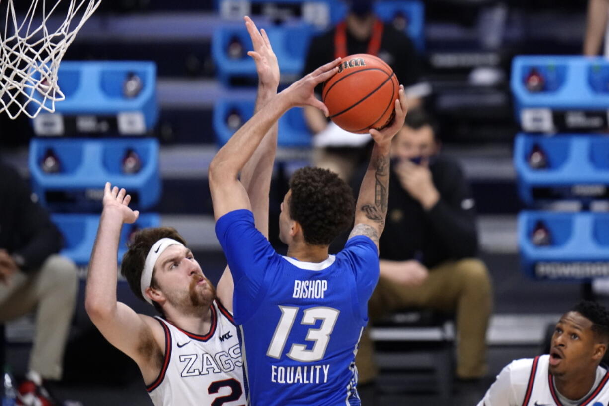 Creighton forward Christian Bishop (13) drives on Gonzaga forward Drew Timme (2) in the first half of a Sweet 16 game in the NCAA men&#039;s college basketball tournament at Hinkle Fieldhouse in Indianapolis, Sunday, March 28, 2021.