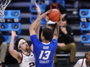 Creighton forward Christian Bishop (13) drives on Gonzaga forward Drew Timme (2) in the first half of a Sweet 16 game in the NCAA men&#039;s college basketball tournament at Hinkle Fieldhouse in Indianapolis, Sunday, March 28, 2021.