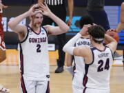 Gonzaga forward Drew Timme (2) celebrates with teammate Corey Kispert (24) after defeating Oklahoma in the second round of the NCAA college basketball tournament at Hinkle Fieldhouse in Indianapolis, Monday, March 22, 2021.