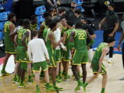 Oregon players celebrate following a second-round game against Iowa. in the NCAA men&#039;s college basketball tournament at Bankers Life Fieldhouse, Monday, March 22, 2021, in Indianapolis. Oregon won 95-80.